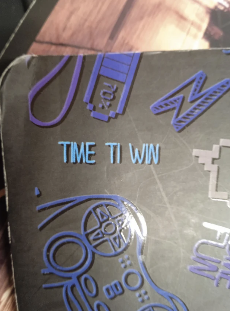 Notebook that reads, "TIME TI WIN"