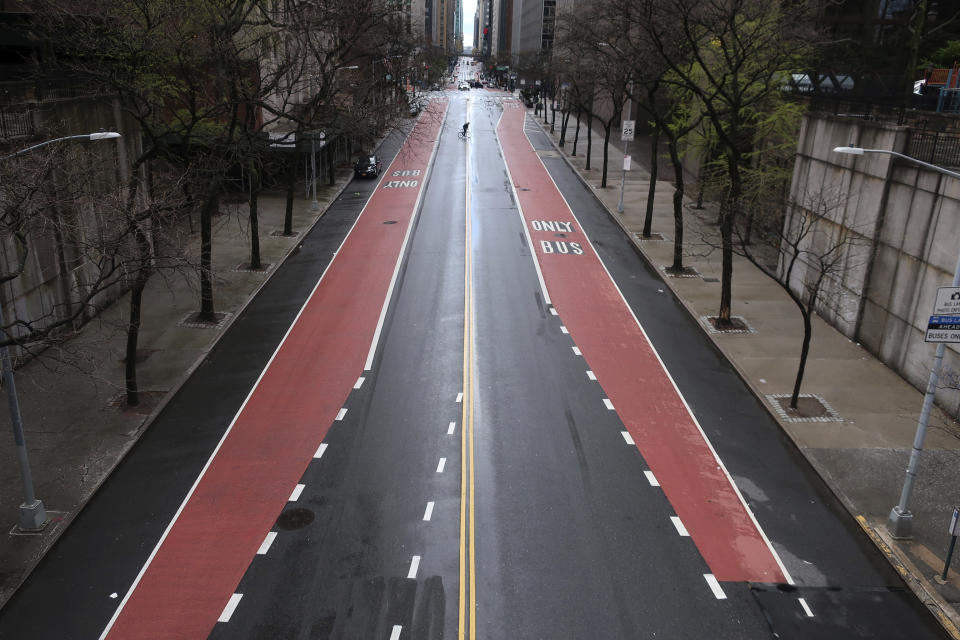 A once busy stretch of 42nd Street in Manhattan has very little traffic during the coronavirus pandemic on Tuesday, April 21, 2020 in New York. (AP Photo/Ted Shaffrey)