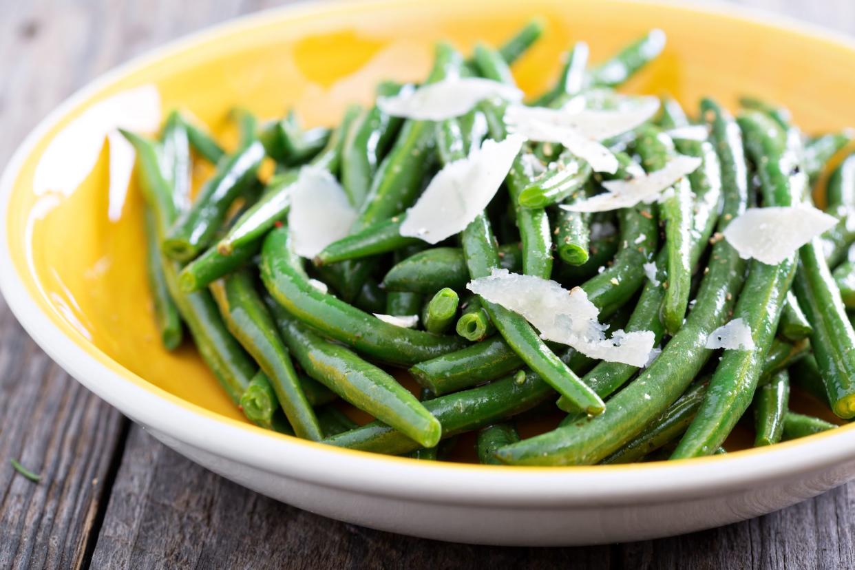 Sauteed green beans with parmesan cheese on big plate