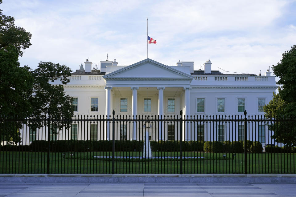 An American flag flies at half-staff over the White House in Washington, Saturday, Sept. 19, 2020, the morning after the death of Supreme Court Justice Ruth Bader Ginsburg. (AP Photo/Patrick Semansky)