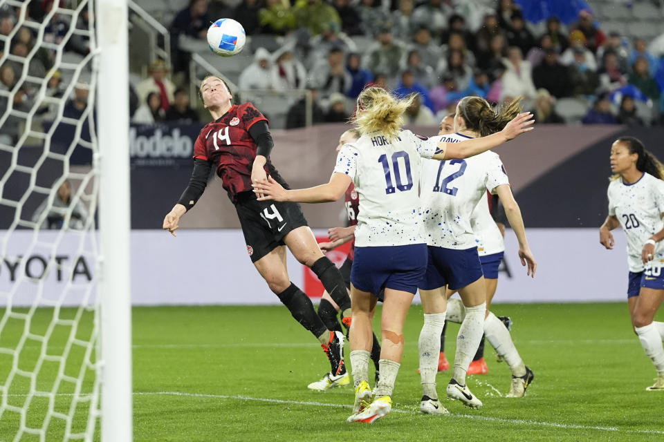 Canada's Vanessa Gilles (14) can't quite reach a header during the second half of a CONCACAF Gold Cup women's soccer tournament semifinal match against the United States, Wednesday, March 6, 2024, in San Diego. (AP Photo/Gregory Bull)