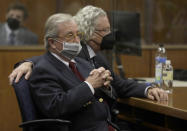 Robert Durst attorney's Dick Deguerin, left, and David Chesnoff listen to the verdict being read by Los Angeles Superior Court Judge Mark E. Windham in court Friday, Sept. 17, 2021 in Inglewood, Calif. A Los Angeles jury convicted Robert Durst on Friday of murdering his best friend 20 years ago, a case that took on new life after the New York real estate heir participated in a documentary that connected him to the slaying that was linked to his wife’s 1982 disappearance. (Genaro Molina/Los Angeles Times via AP, Pool)