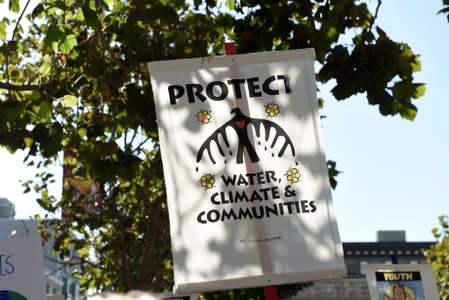 A sign is seen during a Climate Strike march in San Francisco