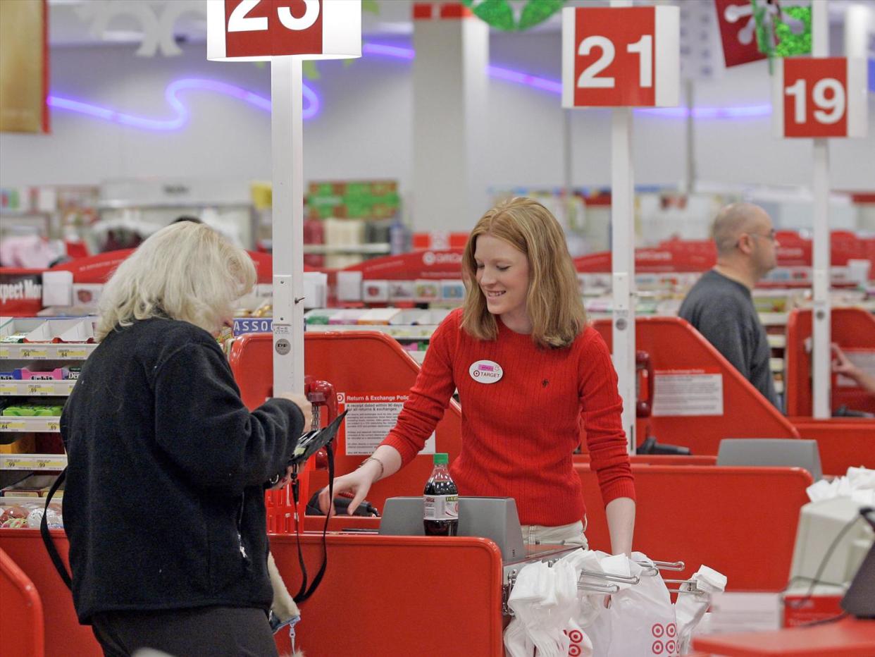 Shopper goes through checkout lane at Target store,  Seattle, Washington, photo