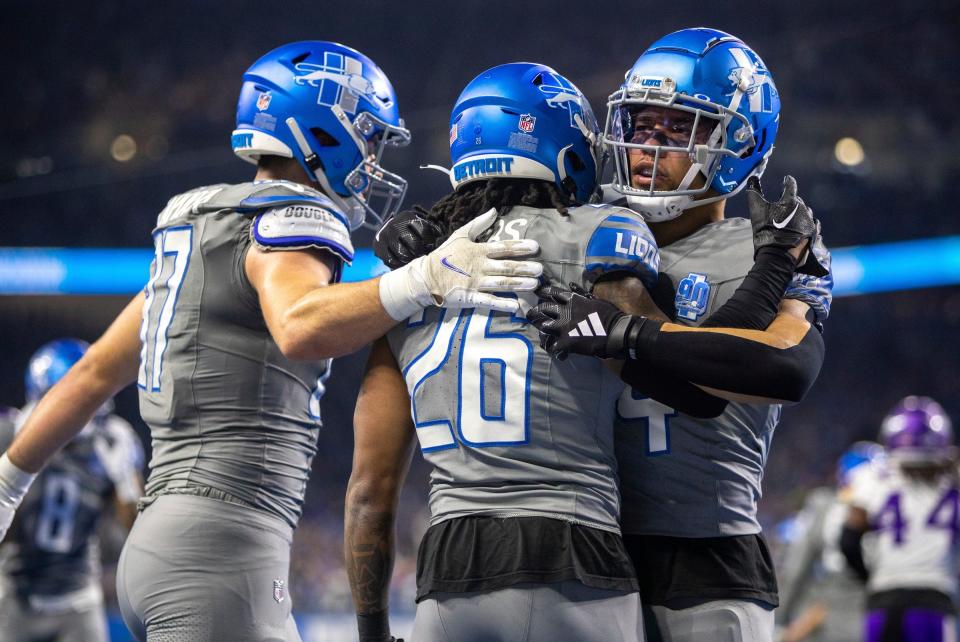 Detroit Lions running back Jahmyr Gibbs (26) celebrates his touchdown run with teammates during the Minnesota Vikings game at Ford Field in Detroit on Sunday, Jan. 7, 2024.