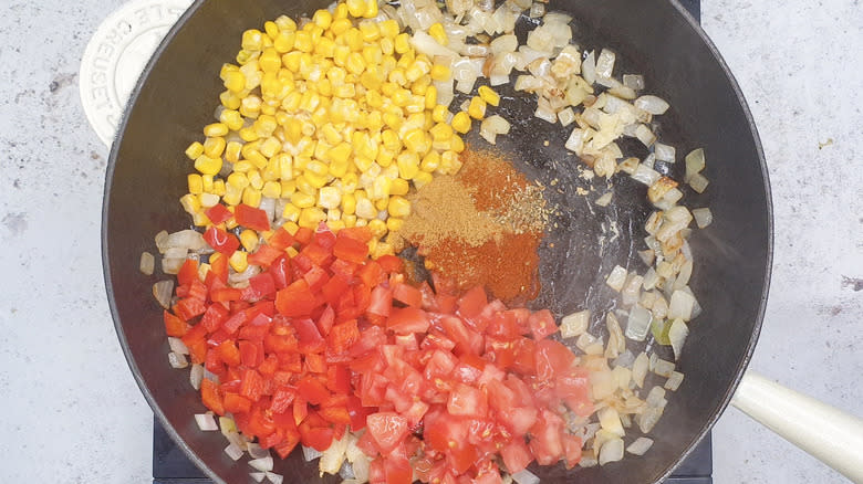 vegetables and spices in frying pan