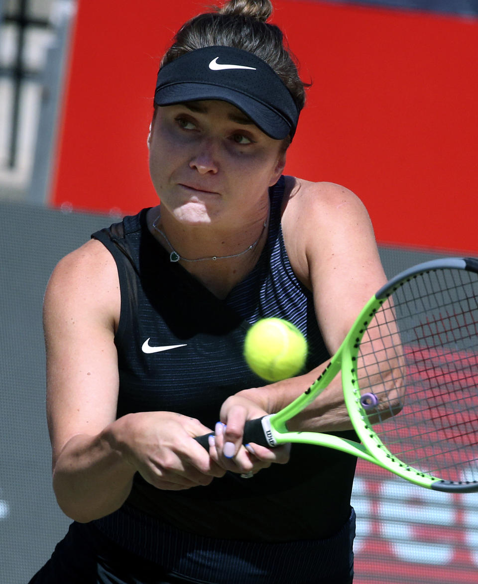 Ukraine's Elina Switolina plays a forehand during her WTA Tour, Singles, 2nd Round tennis match against Russia's Jekaterina Alexandrowa in Berlin, Germany, Wednesday, June 16, 2021. (Wolfgang Kumm/dpa via AP)