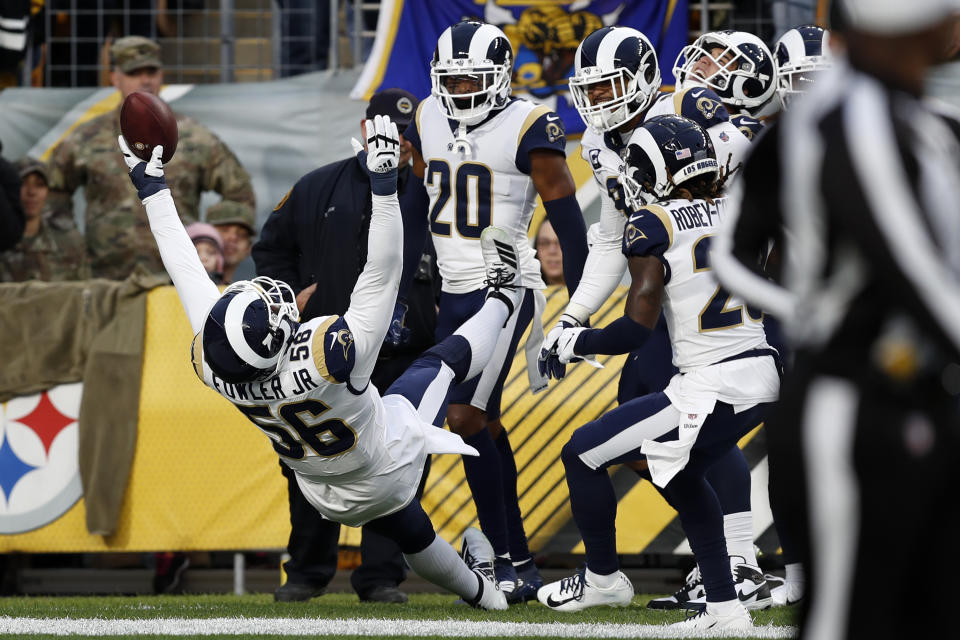 Los Angeles Rams defensive end Dante Fowler (56) celebrates his touchdown on a fumble recovery during the first half of an NFL football game against the Pittsburgh Steelers in Pittsburgh, Sunday, Nov. 10, 2019. (AP Photo/Keith Srakocic)