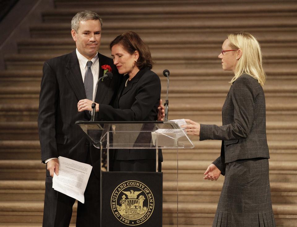 From left, the family of slain U.S. Ambassador J. Christopher Stevens, Tom Stevens, Anne Stevens Sullivan, M.D., and Hilary Stevens Koziol, M.D., embrace after speaking about their brother during a public memorial in the rotunda at City Hall in San Francisco, Tuesday, Oct. 16, 2012. Stevens, 52, and three other Americans were killed Sept. 11 when gunmen attacked the United States Mission in Benghazi, Libya. (AP Photo/Eric Risberg)