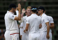 England cricket players celebrate the dismissal of South Africa's AB de Villiers (not pictured) after he was caught out by England's Ben Stokes (C) during the third cricket test match in Johannesburg, South Africa, January 14, 2016. REUTERS/Siphiwe Sibeko