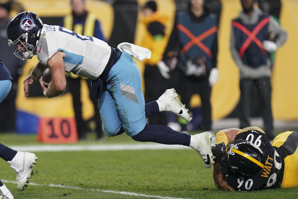 Tennessee Titans quarterback Will Levis, left, is tackled by Pittsburgh Steelers linebacker T.J. Watt (90) during the first half of an NFL football game Thursday, Nov. 2, 2023, in Pittsburgh. (AP Photo/Matt Freed)