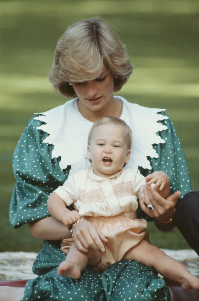 <p>Diana holds Prince William.</p>