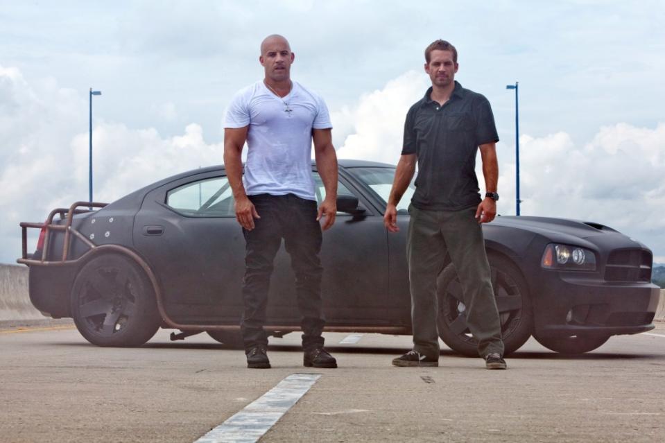 Diesel (left) and Paul Walker in “Fast Five.” ©Universal/Courtesy Everett Collection