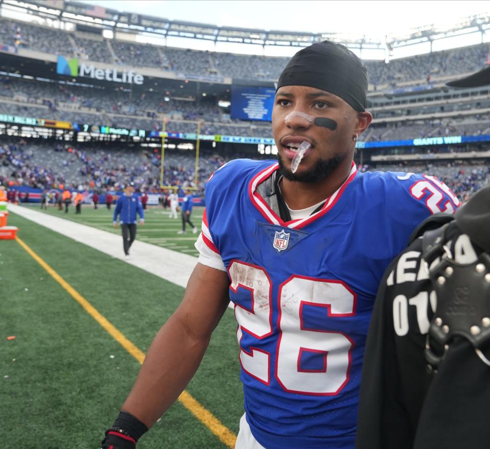 East Rutherford, NJ — October 22, 2023 -- Saquon Barkley of the Giants at the end of the game. The NY Giants host the Washington Commanders at MetLife Stadium in East Rutherford, NJ on October 22, 2023.