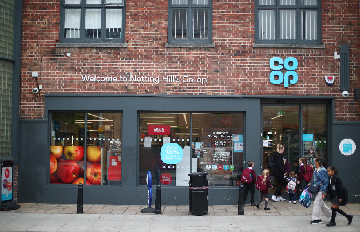 People walk past a Co-op supermarket in London, Britain, September 14, 2018. REUTERS/Hannah McKay