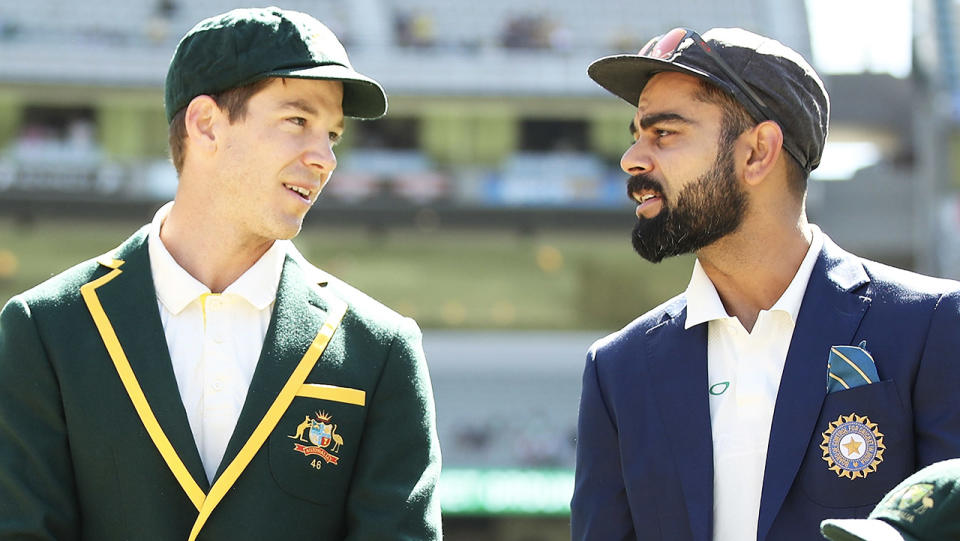 Tim Paine and Virat Kohli talk before the coin toss.