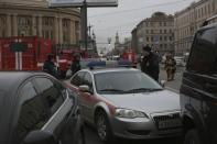 Russian police and emergency personnel block an area at the Tekhnologicheskaya metro station after explosion in St.Petersburg subway in St.Petersburg, Russia, Monday, April 3, 2017. The subway in the Russian city of St. Petersburg is reported an explosion on a subway train. (AP Photo/Yevgeny Kurskov)