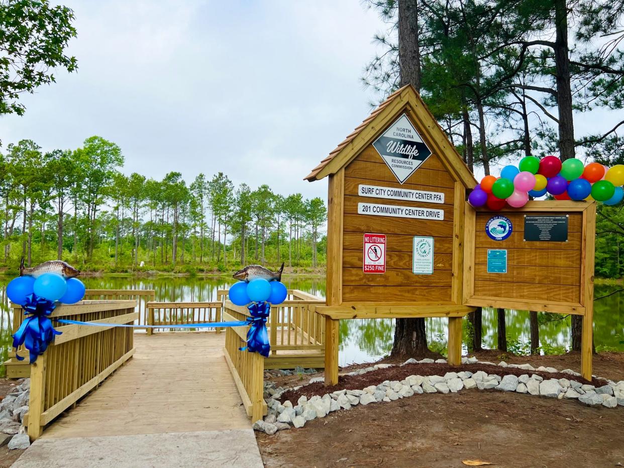 Surf City officials recently celebrated a new fishing area near the community center.