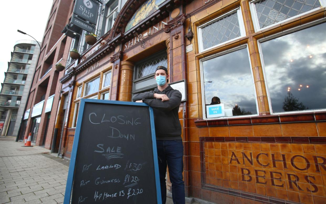 Connor Recknell, pictured with the 'closing down' sign at the Ship Inn, says: 'People have lost jobs, and that will be the case right across Kelham Island' - Lorne Campbell/Guzelian