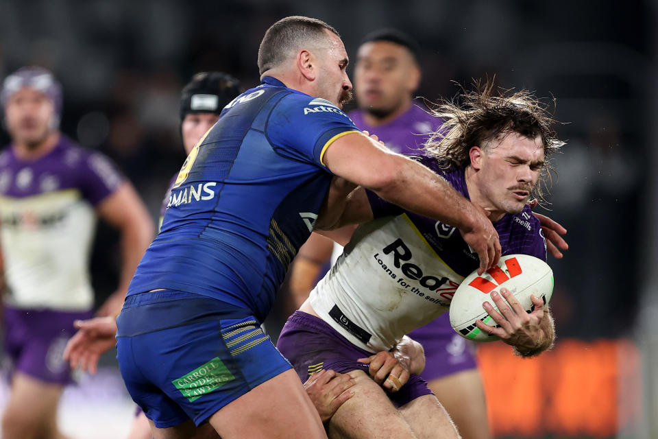 SYDNEY, AUSTRALIA - JULY 26: Ryan Papenhuyzen of the Storm is tackled by the Eels defence during the round 21 NRL match between Parramatta Eels and Melbourne Storm at CommBank Stadium, on July 26, 2024, in Sydney, Australia. (Photo by Brendon Thorne/Getty Images)