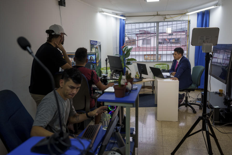 Nicaraguan journalist Hector Rosales, right, does a virtual interview of a Colombian Congresswoman from a studio-apartment used by Nicaraguan journalists in exile who report on their home country from San Jose, Costa Rica, Monday, Aug. 29, 2022. Since the summer of 2021 when Nicaragua President Daniel Ortega locked up dozens of political opponents ahead of November’s presidential elections, Nicaraguans have been seeking asylum in Costa Rica at the highest levels since Nicaragua’s political crisis exploded in April 2018. (AP Photo/Moises Castillo)