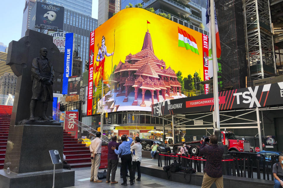 Imagery of the Hindu deity Ram and 3-D portraits of the proposed Hindu temple are displayed on a digital billboard in Times Square, Wednesday, Aug. 5, 2020, to celebrate the groundbreaking ceremony of a temple dedicated to the Hindu god Ram by Indian Prime Minister Narendra Modi in Ayodhya, in New Delhi, India. Hindus rejoiced as Modi broke ground on a long-awaited temple of their most revered god, Ram, at the site of a demolished 16th century mosque. (AP Photo/Ted Shaffrey)