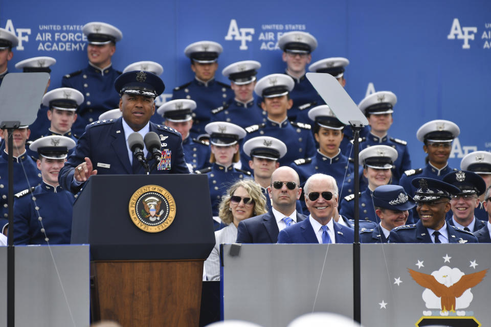 FILE - Lt. Gen. Richard Clark, USAF Superintendent, addresses the Cadet wings as President Joe Biden smiles during the United States Air Force Academy graduation ceremony Thursday, June 1, 2023, at Air Force Academy, Colo. Lt. Gen. Richard Clark was announced Friday, Nov. 10, as the new executive director of the College Football Playoff.(AP Photo/John Leyba, File)