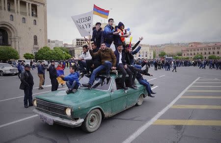People drive a car during a protest against the appointment of ex-president Serzh Sarksyan as the new prime minister and demand an early parliamentary election in Yerevan, Armenia April 21, 2018. Radio Free Europe/Radio Liberty/Handout via REUTERS