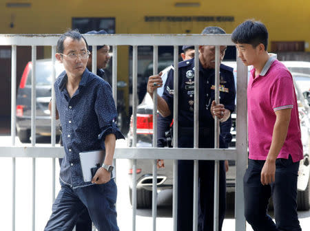 North Korea embassy officials leave the morgue at Kuala Lumpur General Hospital where Kim Jong Nam's body is held for autopsy in Malaysia February 15, 2017. REUTERS/Edgar Su