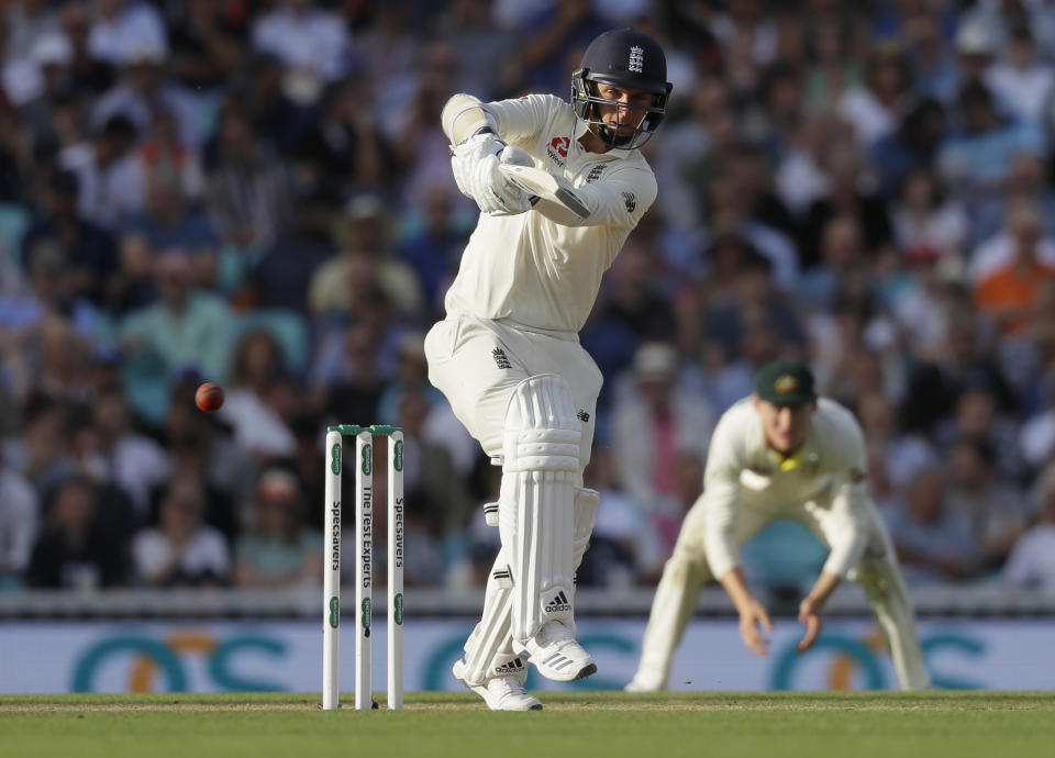 England's Jos Buttler plays a shot off the bowling of Australia's Mitchell Marsh during the third day of the fifth Ashes test match between England and Australia at the Oval cricket ground in London, Saturday, Sept. 14, 2019. (AP Photo/Kirsty Wigglesworth)