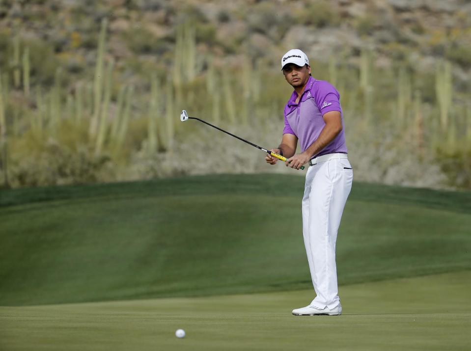 Jason Day watches his putt on the 16th hole in his third-round match against George Coetzee, of South Africa, at the Match Play Championship golf tournament, Friday, Feb. 21, 2014, in Marana, Ariz. (AP Photo/Matt York)