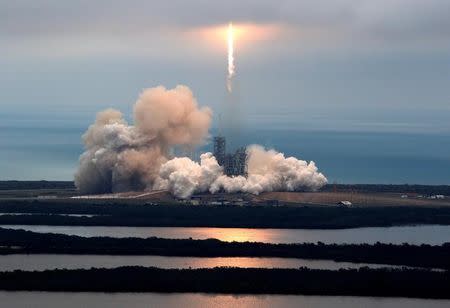 A SpaceX Falcon 9 rocket disappears into clouds after it lifted off on a supply mission to the International Space Station from historic launch pad 39A at the Kennedy Space Center in Cape Canaveral, Florida, U.S., February 19, 2017. REUTERS/Joe Skipper