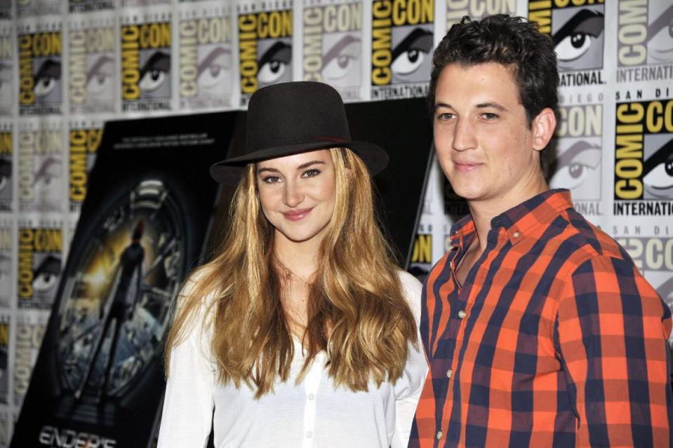 Shailene Woodley, left, and Miles Teller attend the "Divergent" press line on Day 2 of Comic-Con International on Thursday, July 18, 2013 in San Diego, Calif. (Photo by Chris Pizzello/Invision/AP)