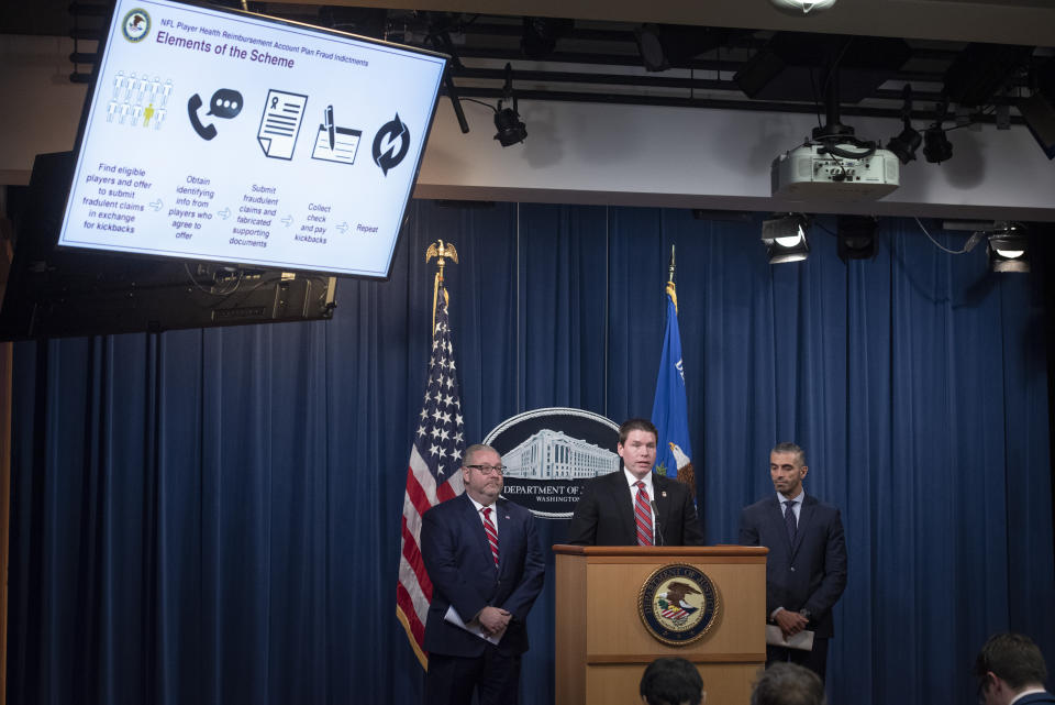 Assistant Attorney General Brian Benczkowski, left, in charge of the criminal division of the Dept. of Justice, U.S. Attorney Robert Duncan, of the Eastern District of Kentucky, center, and FBI Special Agent George Piro, in charge of the FBI's office in Miami, right, appear at a news conference to announce charges against ten former National Football League (NFL) players who are accused of defrauding an NFL health care program, at the Justice Department in Washington, Thursday, Dec. 12, 2019. (AP Photo/Cliff Owen)