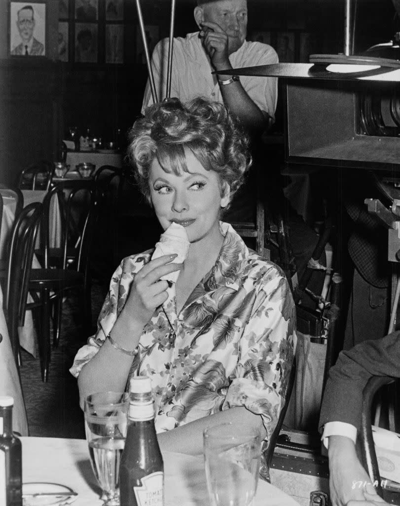 <p>The comedian enjoys an ice cream cone on the Warner Bros film set. She was acting under the direction of Don Weis.</p>