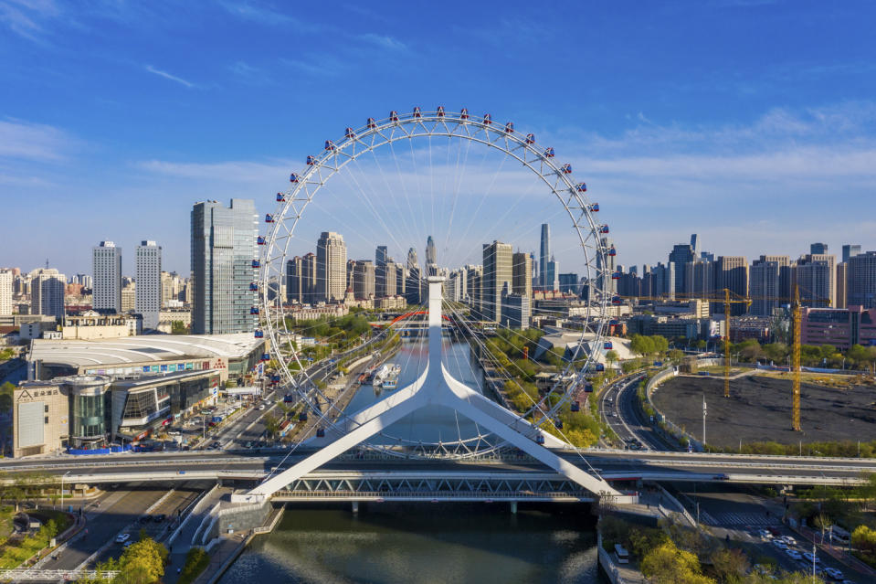 <p>China's 120-meter Tianjin Eye is reportedly the only Ferris wheel built over a bridge: it straddles the Yongle Bridge over the Hai River. </p>