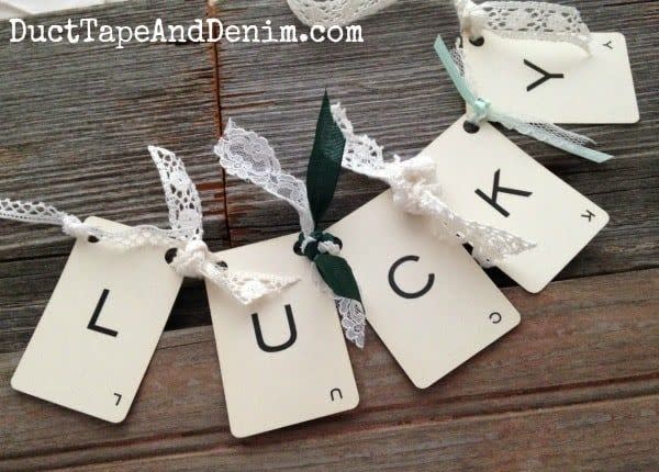 lucky banner spelled out with vintage playing cards tied together with lace and ribbon