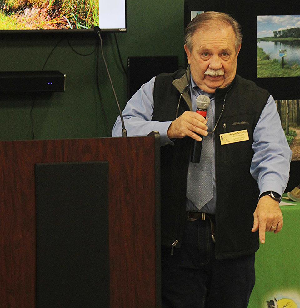 Ashland Parks Commissioner Robert DeSanto talks to the crowd about the new building and how the park retained the property.