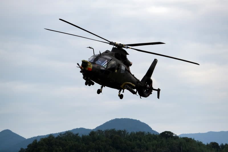 A Light Attack Helicopter (LAH) prototype flies during a display at a Korea Aerospace Industries facility in Sacheon