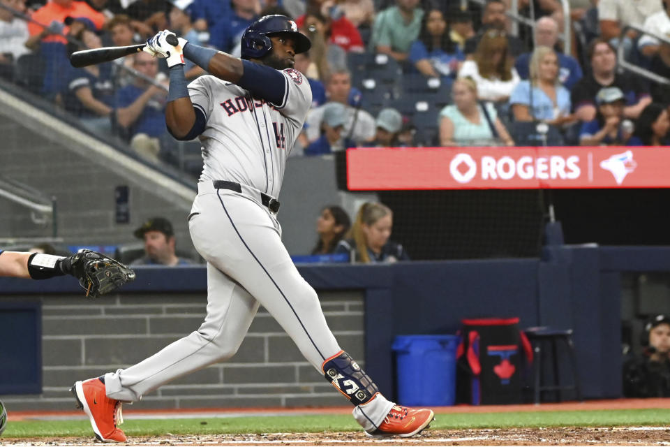 Houston Astros' Yordan Alvarez (44) hits a solo home run against the Toronto Blue Jays during the sixth inning of a baseball game in Toronto on Wednesday, July 3, 2024. (Jon Blacker/The Canadian Press via AP)