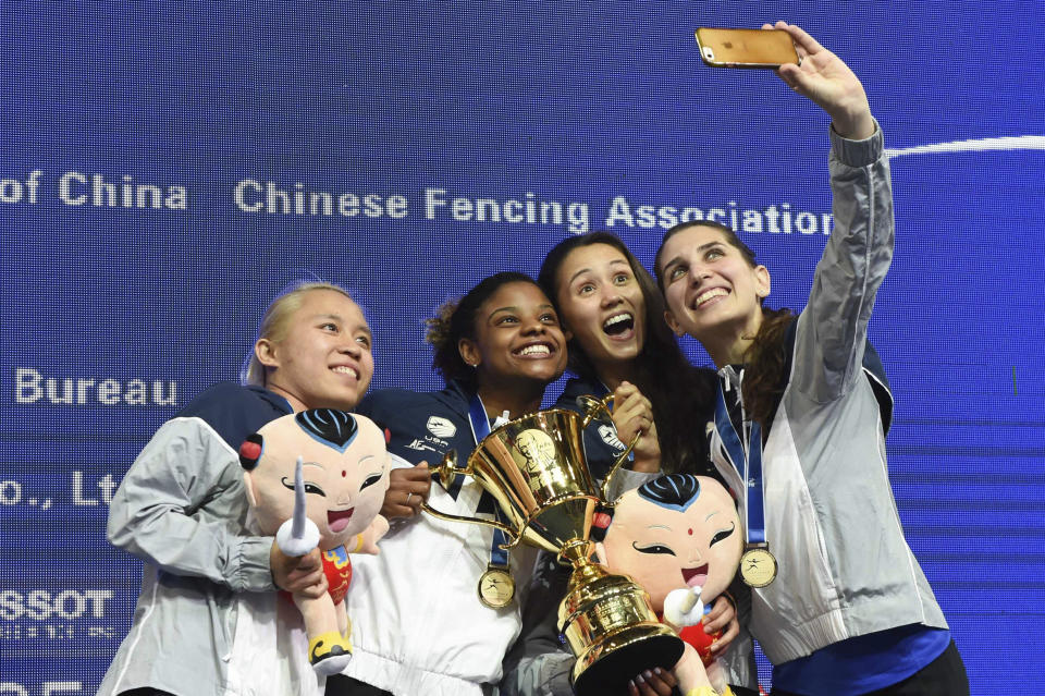 Members of the U.S. women's fencing team — from left, Margaret Lu, Nzingha Prescod, Lee Kiefer, and Nicole Ross — pose for a selfie with their medals after winning the team women's foil finals at the Fencing World Championships in China in 2018. They were the first American squad to win a senior world championship in the foil discipline.