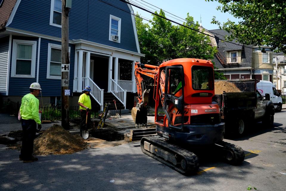 An excavation crew works on a private-side lead pipe replacement on Comstock Avenue in Providence last Monday. The Providence Water Supply Board, responsible for public-side pipe replacements, coordinates with such contractors to clear lead from a home's full supply route.