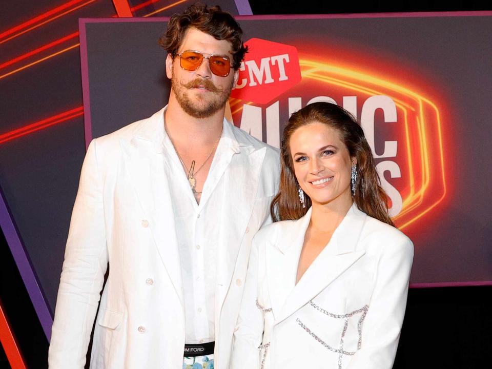 <p>Jason Kempin/Getty</p> Taylor Lewan with his wife Taylin Lewan at the 2021 CMT Music Awards in June 2021 in Nashville, Tennessee.