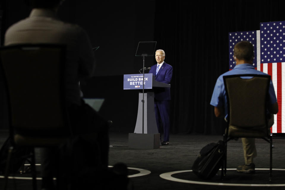 Democratic presidential candidate, former Vice President Joe Biden speaks as reporters sit socially distant during a campaign event, Tuesday, July 14, 2020, in Wilmington, Del. (AP Photo/Patrick Semansky)