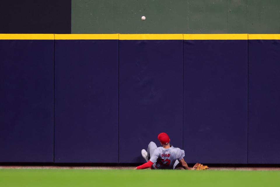Cardinals outfielder Michael Siani is unable to field a ball hit by the Brewers' Rhys Hoskins that went for a three-run homer in the seventh.