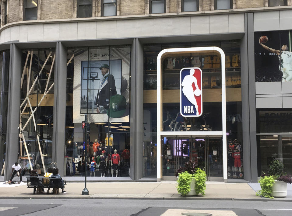 NBA logo in front of an office space. 