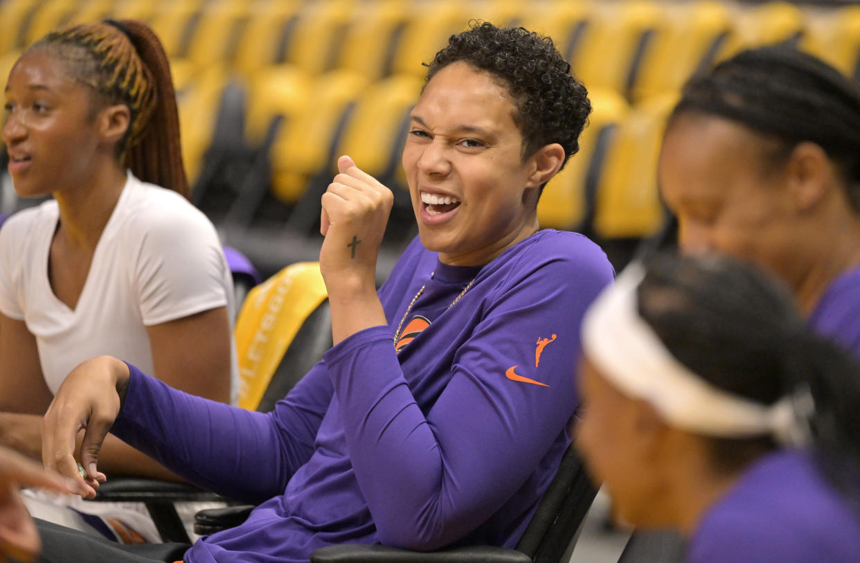 Phoenix Mercury center Brittney Griner laughs as she looks on as players warm up prior to the season-opening game against the Los Angeles Sparks at Crypto.com Arena in Los Angeles on May 19, 2023. (Jayne Kamin-Oncea/USA TODAY Sports)