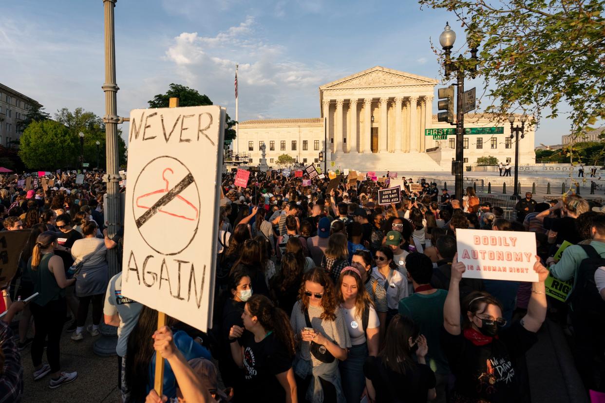 Demonstrators protest outside of the U.S. Supreme Court, May 3, 2022 in Washington. 