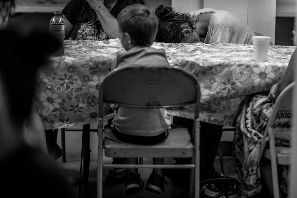 <p>Neighborhood residents attend a free Sunday breakfast and church service at La Requena Belen church in Middletown, Ohio. A young boy picks at cereal.<br> (Photograph by Mary F. Calvert for Yahoo News) </p>