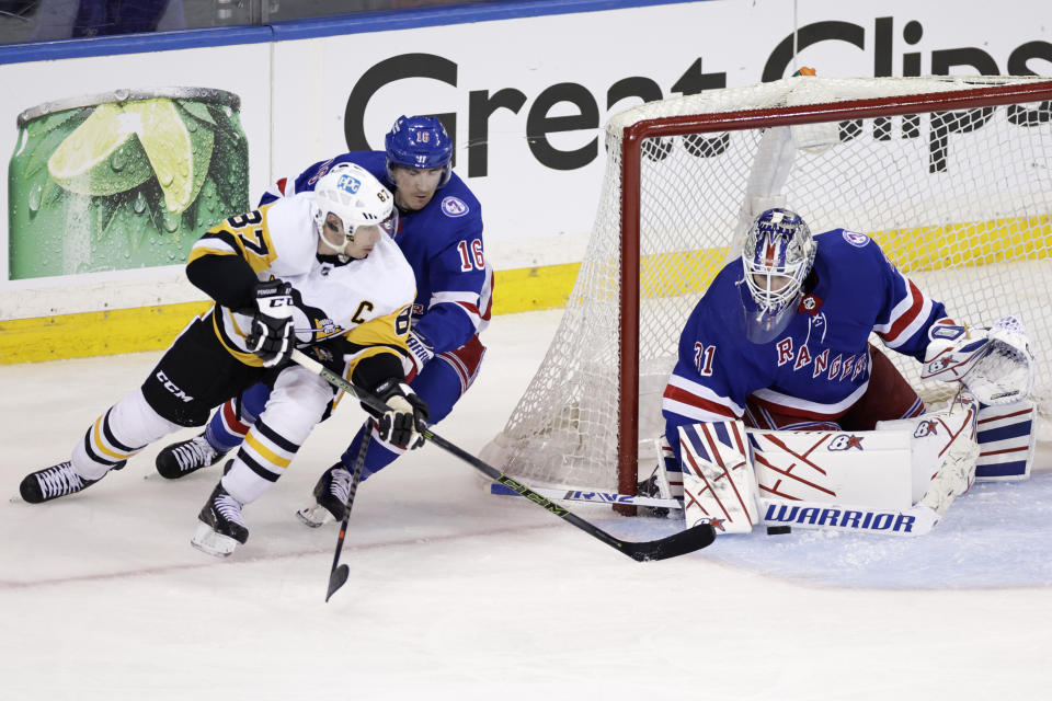 New York Rangers goaltender Igor Shesterkin blocks a shot by Pittsburgh Penguins center Sidney Crosby (87) in the second overtime of Game 1 of an NHL hockey Stanley Cup first-round playoff series Tuesday, May 3, 2022, in New York. (AP Photo/Adam Hunger)